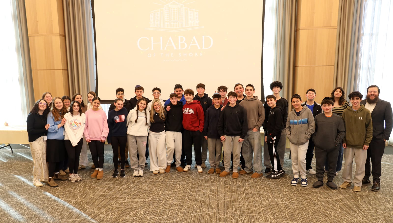 A large group gathers for a photo at Chabad of the Shore.